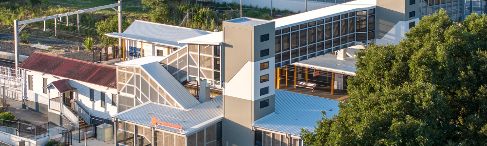 This image shows an artist impression of what the new station will look like from the section of the station carpark closest to 