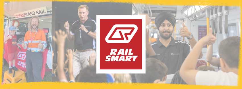 A Community Education Coordinator in a safety vest presenting to a group in a warehouse setting